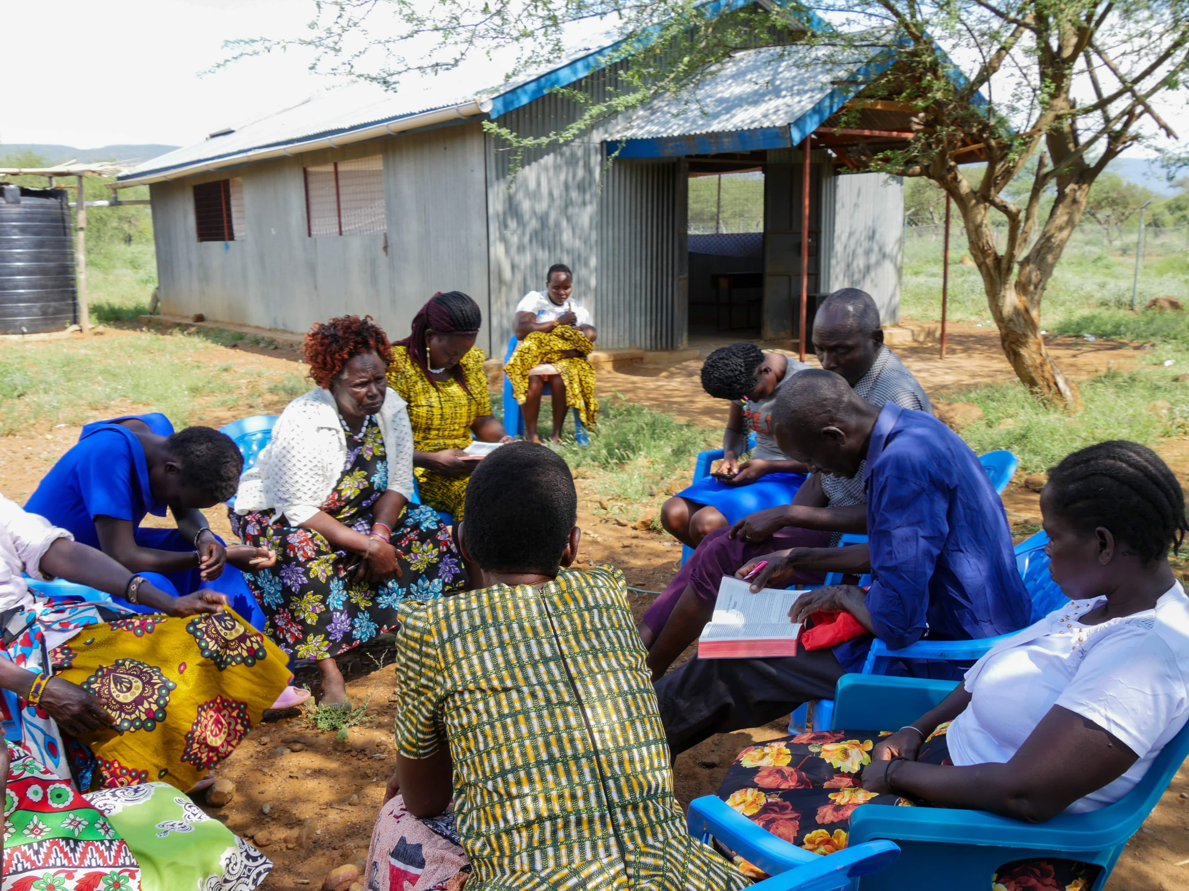 Church leaders and community members engaging in training and Scripture study